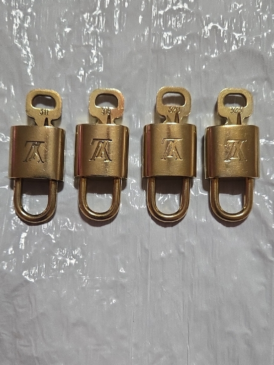 Louis Vuitton Handbags - Louis Vuitton Gold Padlock Set of Four with LV Monogram